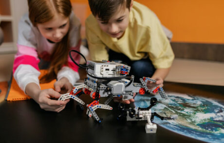 Two kids building robotics